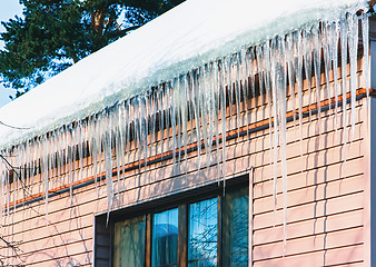 Image showing Icicles And Snow On The Roof