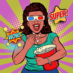 Image showing woman in 3D glasses watching a movie, smiling and eating popcorn