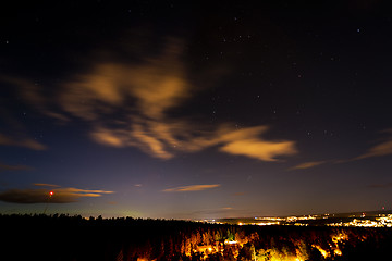Image showing A city and a forest under the sky with stars. Sweden
