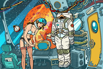 Image showing Sexy female astronaut undresses after working in a spaceship