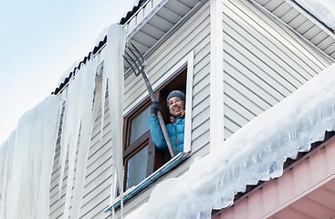 Image showing Snow And Icicles Removal From The Roof