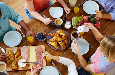 Image showing group of people having breakfast at table