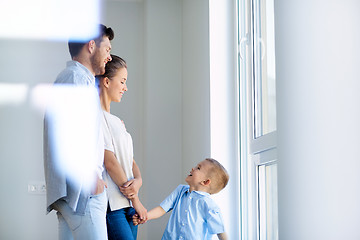 Image showing happy family with child at new home or apartment