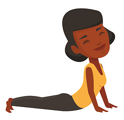 Image showing Woman practicing yoga upward dog pose.