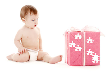 Image showing baby boy in diaper with big puzzle gift box