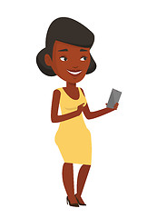 Image showing Young smiling woman holding mobile phone.