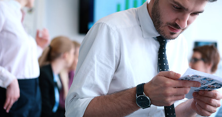 Image showing Businessman using tablet in modern office