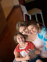 Image showing Young Family Using A Tablet To Make Future Plans