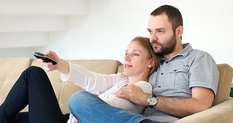 Image showing senoior couple watching tv in modern villa