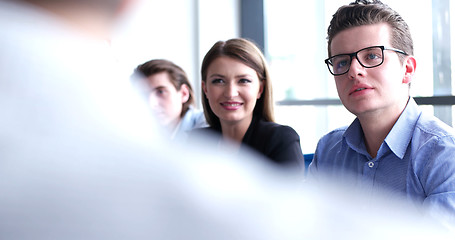 Image showing group of business people having a meeting in bright office