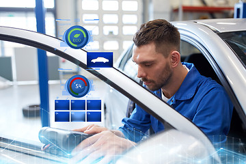 Image showing mechanic man with diagnostic scanner at car shop