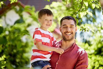 Image showing happy father and son at summer garden