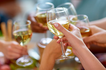 Image showing hands clinking wine glasses