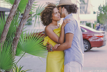 Image showing Couple standing and embracing on the street