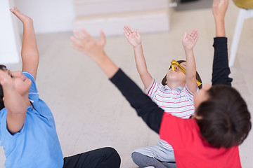 Image showing young boys having fun on the floor