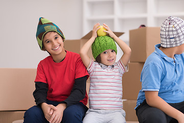 Image showing boys with cardboard boxes around them