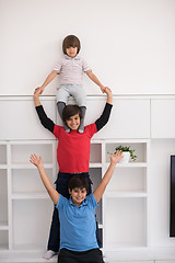 Image showing young boys posing line up piggyback