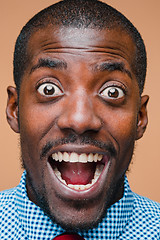 Image showing The portrait of handsome young surprised black african man