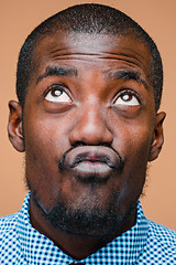 Image showing Positive thinking African-American man on brown background