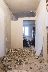 Image showing Dismantling the walls in the apartment, in the background are boxes with things