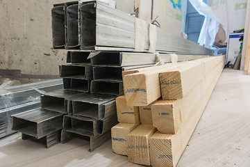 Image showing Building materials - wooden bars and metal profiles, on the floor in the apartment