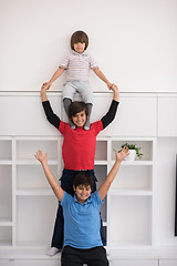 Image showing young boys posing line up piggyback