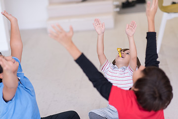 Image showing young boys having fun on the floor