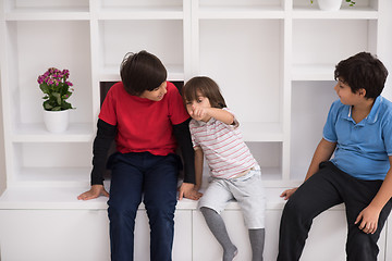 Image showing young boys posing on a shelf