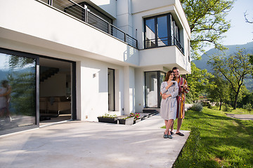 Image showing Young beautiful couple in bathrobes