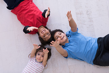 Image showing young boys having fun on the floor