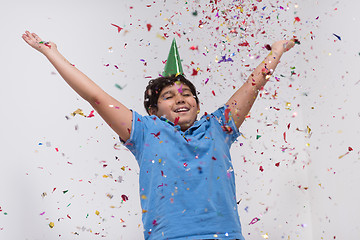 Image showing kid blowing confetti