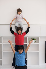 Image showing young boys posing line up piggyback