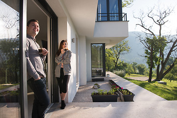 Image showing couple enjoying on the door of their luxury home villa