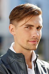 Image showing portrait of young man in leather jacket outdoors