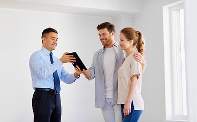 Image showing couple and realtor with tablet pc at new home