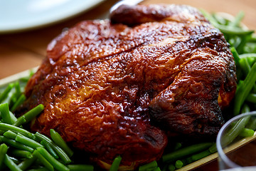 Image showing close up of roast chicken with green beans