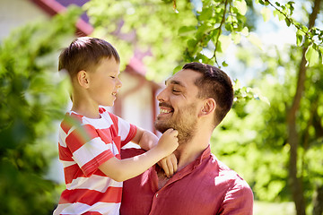 Image showing happy father and son at summer garden