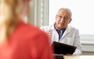 Image showing senior doctor and patient at womens health clinic