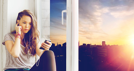 Image showing teenage girl with smartphone and earphones