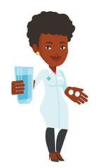 Image showing Pharmacist giving pills and glass of water.