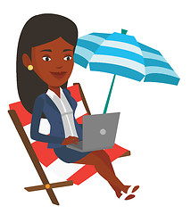 Image showing Businesswoman working on laptop at the beach.