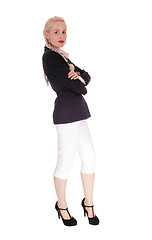 Image showing Business woman standing in jacked and white pants