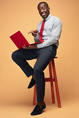 Image showing Handsome Afro American man using a laptop