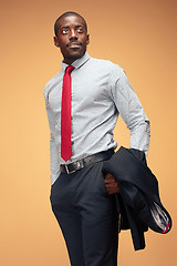 Image showing cheerful african businessman looking at the camera