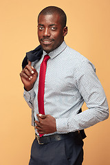 Image showing cheerful african businessman looking at the camera