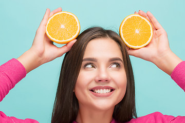 Image showing Beautiful woman\'s face with juicy orange