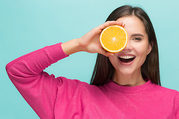 Image showing Beautiful woman\'s face with juicy orange