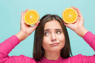 Image showing Beautiful woman\'s face with juicy orange