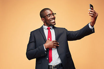 Image showing Young african business man on the phone