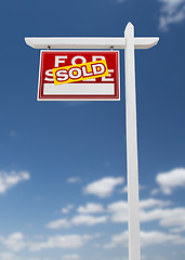 Image showing Left Facing Sold For Sale Real Estate Sign on a Blue Sky with Cl